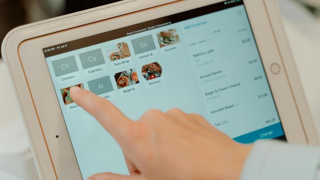 A person using an iPad to review documents, representing the solar application process.